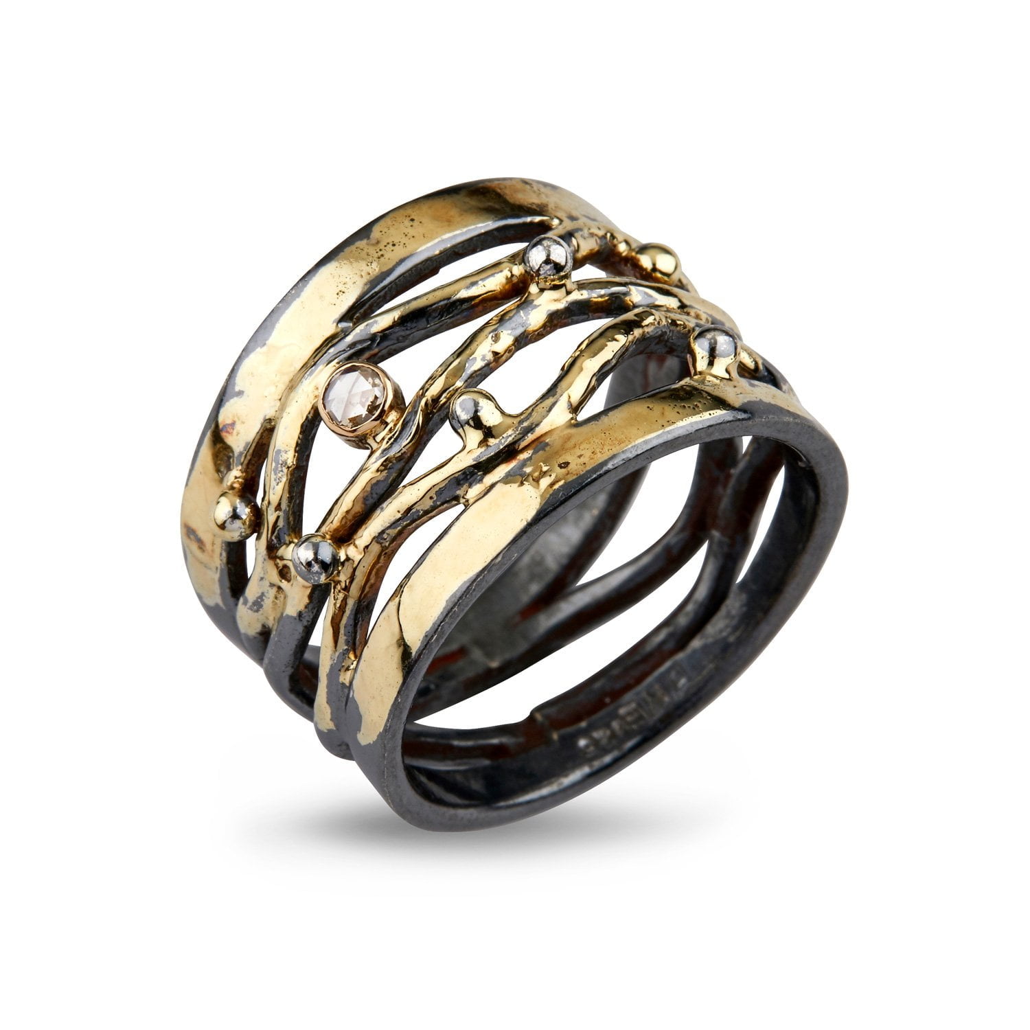 silver ring with open wires of gold and diamond